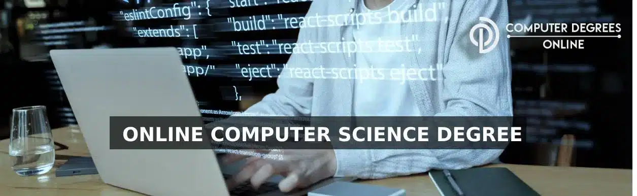 online computer science degree a person is typing on a laptop and code is reflecting showcasing as person is coding.